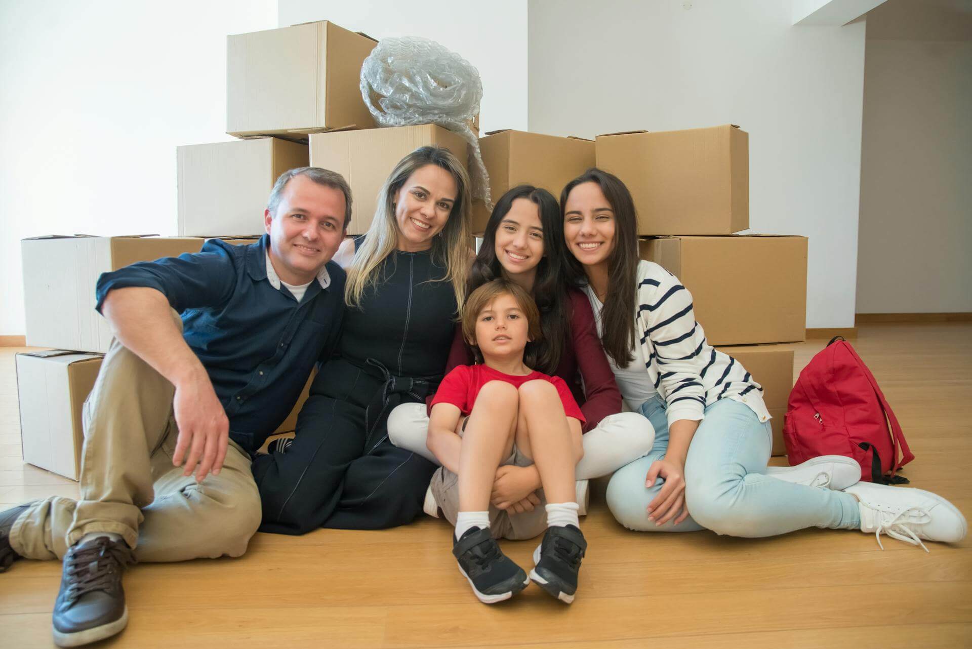 Family Smiling with Boxes